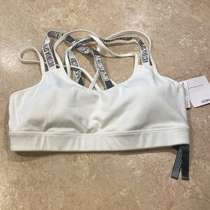 White Victoria’s Secret sports bra size large. Never worn.